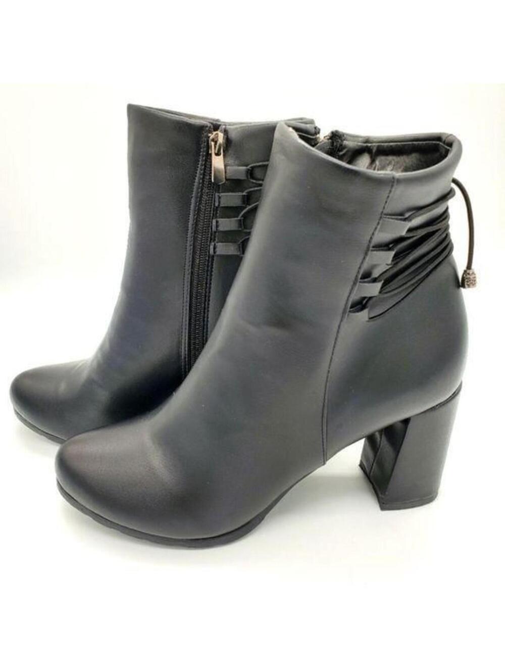Black leather heeled boots with straps